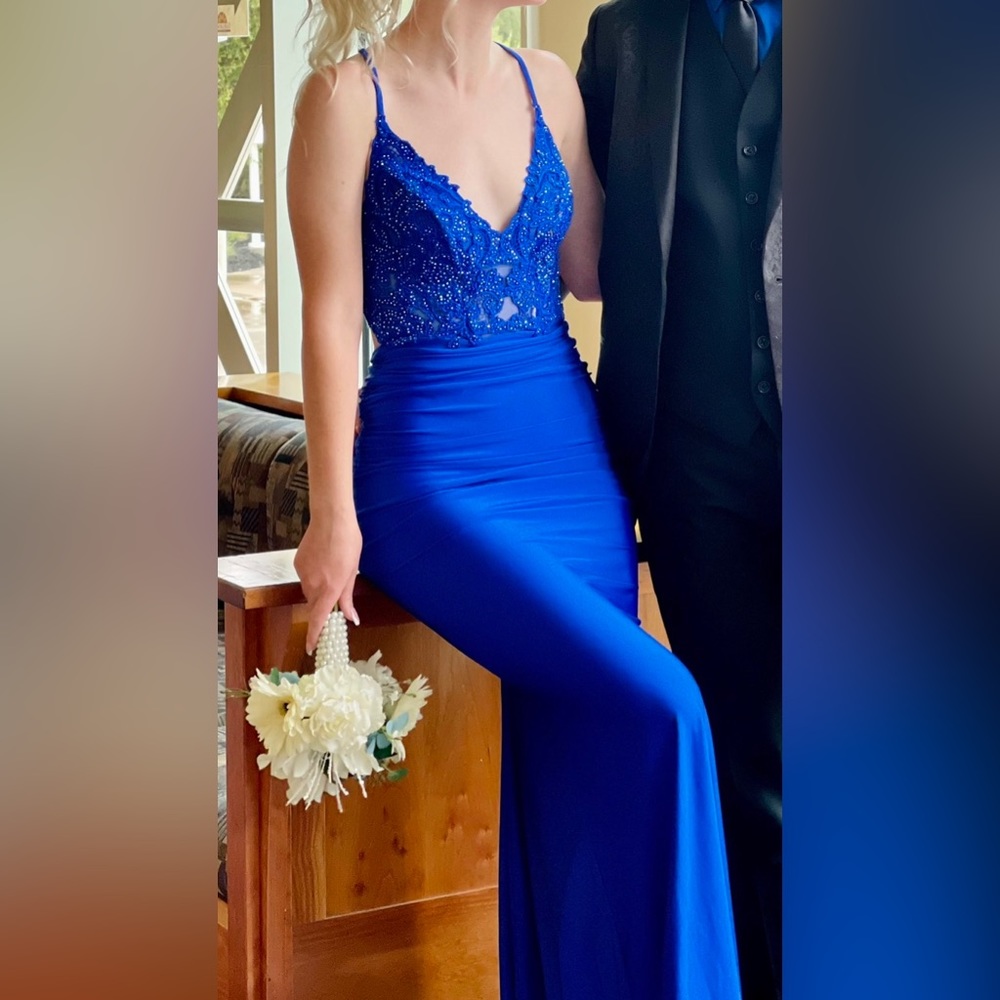 Beautiful blue dress with detailed beading. Worn but like new.